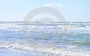 Beach and sea in south italy on a windy day with waves and sun, travel, holiday concept. Good background