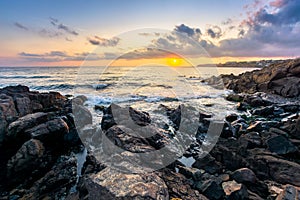 beach of the sea at sunset. wonderful scenery with stones in the water
