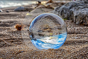 Beach seen in a glass ball