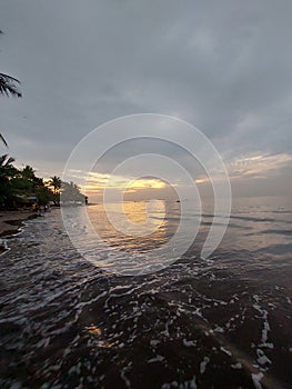 At the beach. The setting sun brings with it a beauty and serenity that suggests that it is time for a short break