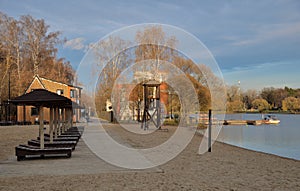 Beach on shore of Meshchersky pond in Meshchersky natural park Bakovsky forest park in autumn, Odintsovsky district of Moscow re