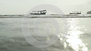 Beach in Sihanoukville, Cambodia, Asia. Boat at sea near the shore