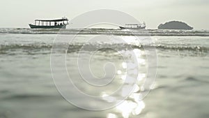 Beach in Sihanoukville, Cambodia, Asia. Boat at sea near the shore