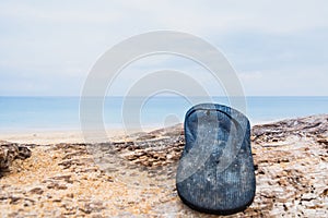 Beach slippers on a sandy beach in Phuket, Thailand