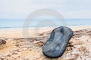 Beach slippers on a sandy beach in Phuket, Thailand