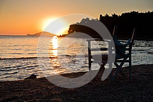 Beach with small director like chair at sunset in Sithonia