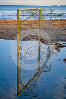 The beach soccer field is flooded with water