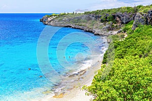 Beach of the 1000 steps in Bonaire on a rock