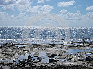 beach with stones and clouds