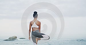 Beach, stretching and woman doing a yoga exercise for calm mindset, balance and health. Nature, meditation and back of