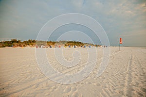 Beach summer background. Sea vacation.Seaside resort.White sandy beaches and Beach cabins on white sand.Beach summer