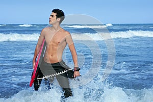 Beach summer beach portrait of young surfer