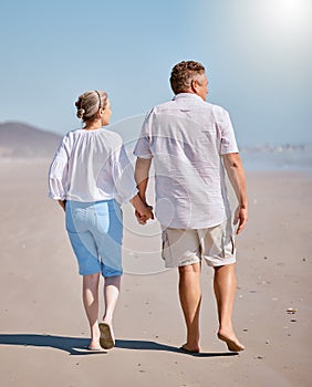 Beach, summer and senior couple walking for exercise while on vacation, adventure or journey. Love, holding hands and