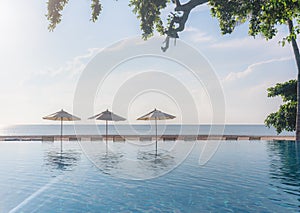 Beach in summer with swimming pool in sunset, beach background. Summer Vacation