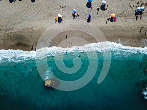 Beach with sun loungers on the coast of the ocean