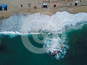 Beach with sun loungers on the coast of the ocean