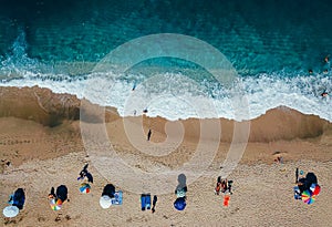 Beach with sun loungers on the coast of the ocean