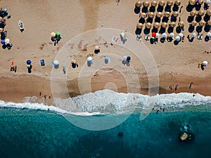 Beach with sun loungers on the coast of the ocean