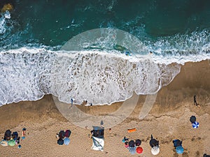 Beach with sun loungers on the coast of the ocean