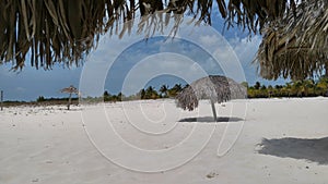Beach with sun parasols