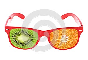 Beach sunglasses concept with kiwi fruit on white background