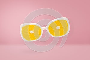 Beach sunglasses with orange lens on pink pastel, summer concept