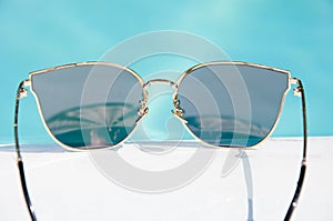 Beach sunglasses at swimming pool. summer holiday and beach vacation. summer beach party