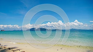 Beach on a sunny day. Kradan Island, an island in the Andaman Sea, Thailand. Tropical Island white sand beach, pine tree,