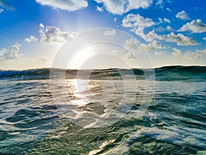 Beach Sunrise, Green Ocean Wave, Clouds & Blue Sky