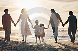 Beach, sunset and back of family holding hands in nature for travel, bond and fun together. Rear view, love and children