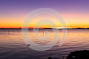 Beach sunset with calm sea scene