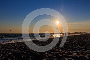 Beach sunset at Cape May New Jersey with silhouettes