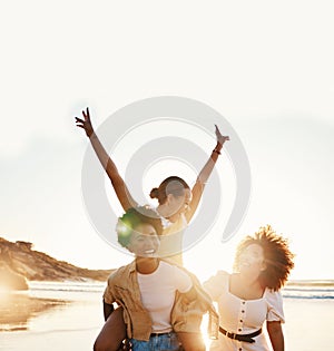 Beach sunset, happy and group of friends piggyback, smile and enjoy travel vacation, summer freedom or tropical