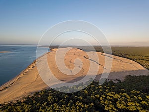 the beach at sunset in queensland as seen from a helicopter