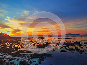 On the beach at sunset, the scenery that unfolds before the eyes is a stunning panorama