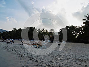 beach at sunset with some people