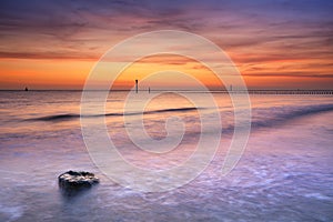 Beach at sunset in Zeeland, The Netherlands