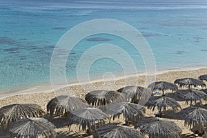 Beach with sunshades top view