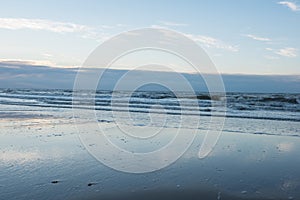 Beach and surf of the North Sea in Koksijde, Belgium