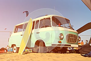 beach surf van with board on the beach