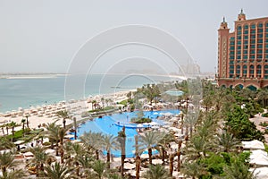 The beach and swimming pool at luxury hotel