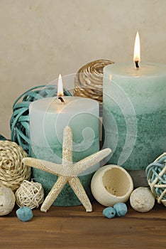 Beach theme spa concept with ocean elements on a warm wooden background