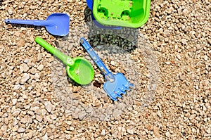 Beach toys - bucket, spade and shovel on the beach