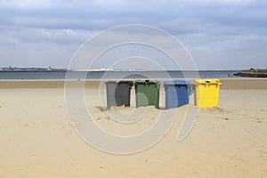 Beach with trashcans