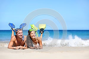 Beach travel couple having fun snorkeling looking" border="0