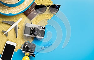 Beach travel object and gadgets for Vacation Traveler on blue copy space