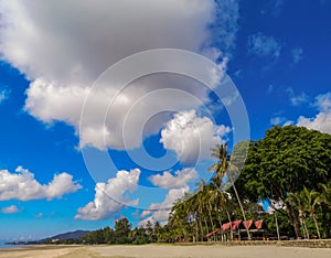 Beach on the tropical island. Clear blue water, sand and palm trees. Beautiful vacation spot, treatment and aquatics.