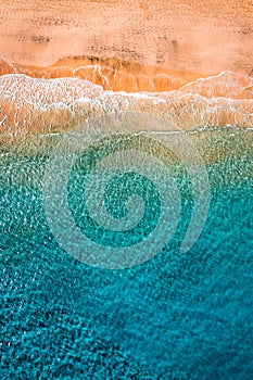 Beach with turquoise water on Fuerteventura island, Spain, Canary islands. Aerial view of sand beach, ocean texture background,