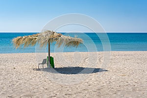 Beach umbrela on sandy beach