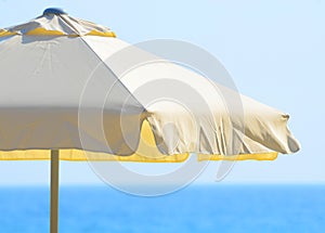 Beach umbrella against the sea and sky